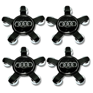 Set of four Audi center caps for rims with black and chrome star design.